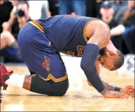  ?? DARREN ABATE / AP ?? Cleveland Cavaliers forward LeBron James falls during the second half of Monday’s 103-74 loss to the Spurs in San Antonio. The Cavaliers fell a half-game behind Boston for the top seed in the Eastern Conference playoffs.