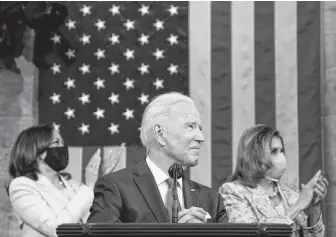  ?? REUTERS ?? President Joe Biden addresses a joint session of Congress, with Vice-president Kamala Harris, left, and House Speaker Nancy Pelosi on the dais behind him, in Washington, on Wednesday.