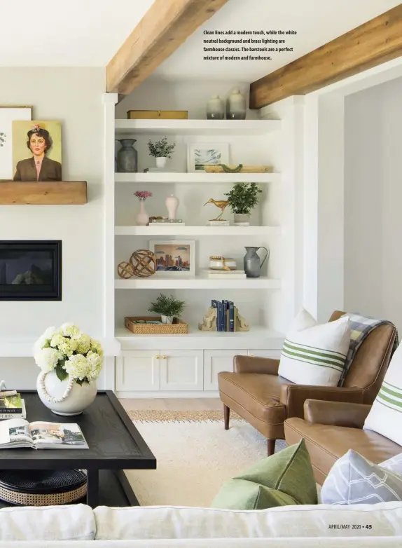  ??  ?? Clean lines add a modern touch, while the white neutral background and brass lighting are farmhouse classics. The barstools are a perfect mixture of modern and farmhouse.