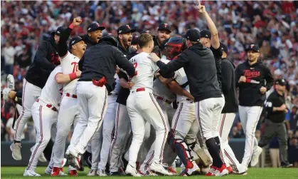  ?? ?? The Minnesota Twins storm the field after defeating the Toronto Blue Jays. Photograph: Jesse Johnson/USA Today Sports