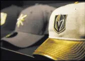  ?? Rachel Aston Las Vegas Review-Journal @rookie__rae ?? Knights plastic hockey sticks, mugs and hats are among the items available at The Armory team store at T-Mobile Arena.