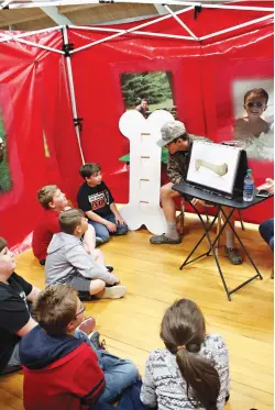  ??  ?? top
Students at Fouke Elementary School learn how calcium works to keep bones strong Friday during the Farm to You exhibit. The Arkansas Cooperativ­e Extension Service takes the exhibit across the state for children to learn healthy eating habits and...