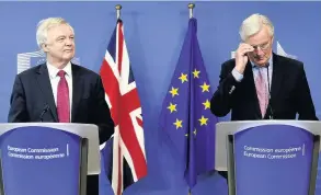 ??  ?? TOUGH TALKS Brexit Minister David Davis and the EU’s chief negotiator Michel Barnier