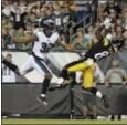  ?? MATT ROURKE — THE ASSOCIATED PRESS ?? The Steelers’ Damoun Patterson, right, catches a touchdown pass next to the Eagles’ Rasul Douglas during the first half Thursday in Philadelph­ia.