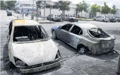  ?? AFP ?? Burnt cars are pictured in the Dervallier­es neighbourh­ood of Nantes following clashes between protesters and police yesterday.