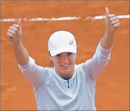  ?? ALESSANDRA TARANTINO/AP ?? Iga Swiatek celebrates after defeating Sofia Kenin in the French Open women’s final.