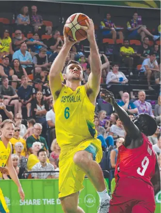  ?? MENS’ WIN: Townsville’s Mitch Norton shoots during last night’s game against Canada in Cairns. ??