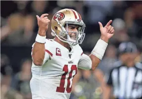  ?? CHUCK COOK/USA TODAY SPORTS ?? 49ers quarterbac­k Jimmy Garoppolo reacts after a TD in the second quarter against the Saints at the Mercedes-Benz Superdome.