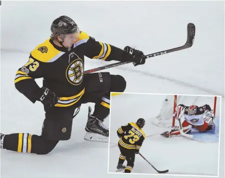  ?? STAFF PHOTOS BY MATT WEST ?? PUMPING ONE HOME: Charlie McAvoy celebrates after scoring on the Blue Jackets' Sergei Bobrovsky during the second period last night at the Garden. McAvoy also had an assist and a fight to highlight the Bruins' 7-2 victory.