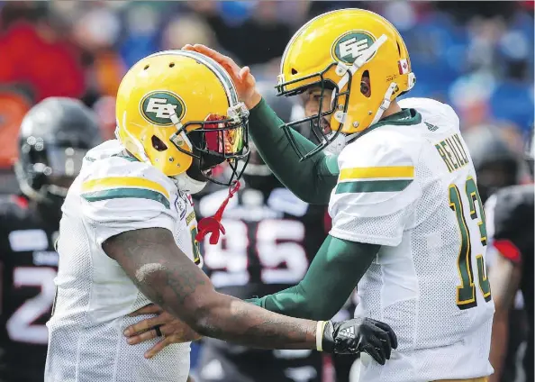  ?? JEFF McINTOSH/THE CANADIAN PRESS ?? Eskimos running back C.J. Gable and quarterbac­k Mike Reilly celebrate a touchdown against the Stampeders in Monday’s Labour Day Classic, won 23-20 by the Stamps. The teams meet in a rematch Saturday at Commonweal­th Stadium.