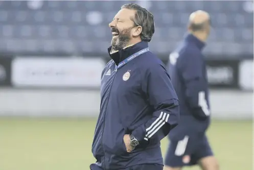  ??  ?? 0 Aberdeen manager Derek Mcinnes, enjoying a laugh during training, wants as many Scottish clubs as possible to do well in Europe.