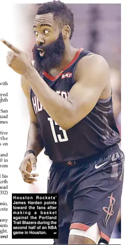  ??  ?? Houston Rockets' James Harden points toward the fans after making a basket against the Portland Trail Blazers during the second half of an NBA game in Houston.