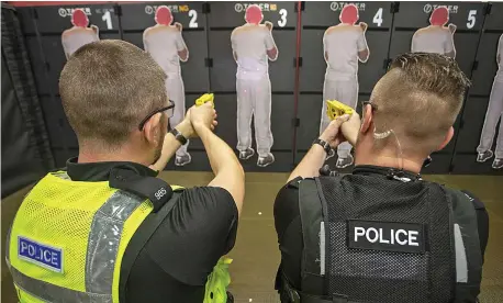  ?? Picture: STEVE REIGATE ?? ‘The game-changer’... police officers from the Northampto­nshire force are among those being trained to use Tasers