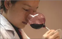  ??  ?? A sommelier samples wine at the Ao Yun vineyards, located beneath the Meili mountain in Adong, in southweste­rn China’s Yunnan province.