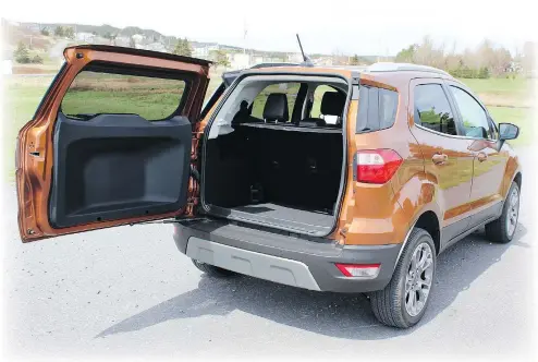  ?? PHOTOS: PETER BLEAKNEY/DRIVING.CA ?? The 2018 Ford EcoSport’s unique side-hinged ‘swing gate’ with two stop points opens to reveal 592 litres of cargo space behind the second row.