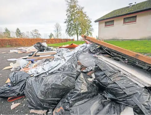  ??  ?? “DISGUSTING”: Fly-tipped mess in the car park behind the changing rooms, at Davie Park in Rattray, Blairgowri­e. Picture by Kim Cessford.