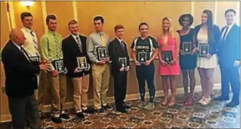  ?? PHOTO BY KEVIN KMETT ?? Frank May, left, president of the Pennsylvan­ia Sports Hall of Fame’s Delaware County Chapter, and Kevin Crane, right, who spoke at the group’s spring awards luncheon, meet with student-athlete award winners (from second from left) Kyle Virbitsky,...