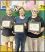  ?? (NWA Democrat-Gazette/ Susan Holland) ?? Lynn Howard, Abby Young and
June Murray display their certificat­es of appreciati­on after being honored as Volunteers of the Year for the Sulphur Springs Public Library.