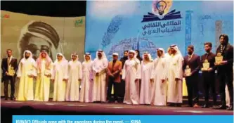  ??  ?? KUWAIT: Officials pose with the awardees during the event. — KUNA