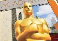  ?? FILE PHOTO BY MATT SAYLES/INVISION/AP ?? In 2015, an Oscar statue stands outside the Dolby Theatre for the 87th Academy Awards in Los Angeles. This year’s Oscars will be held Sunday. The ceremony is set to begin at 8 p.m. EST on ABC.