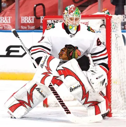  ?? JOEL AUERBACH/GETTY IMAGES ?? Collin Delia has started two of the Hawks’ first three games in net and has a subpar .848 save percentage.