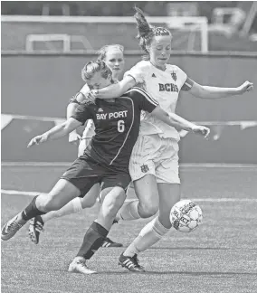  ?? / FOR THE JOURNAL SENTINEL ?? Claire Haynes of Brookfield Central (right) collides with Erika Hess of Bay Port in the first half of Saturday’s Division 1 championsh­ip game.