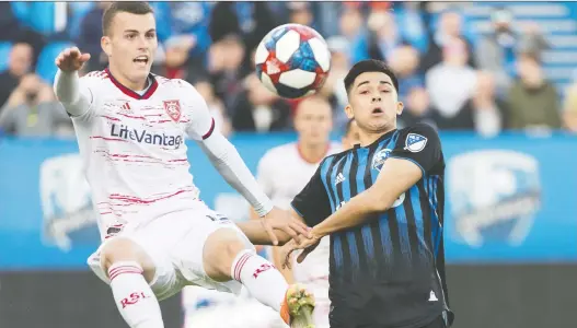  ?? GRaHAM HUGHES/THE CANADIAN PRESS ?? Montreal Impact’s Mathieu Choiniere challenges Real Salt Lake’s Brooks Lennon during Wednesday’s 2-1 Impact victory at Saputo Stadium.