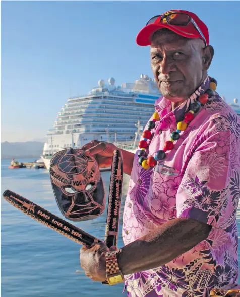  ?? Photo: Wati Talebula ?? Apakuki Tabuakuro with some of his own designs, which he sells in Suva to tourists, some of whom came onboard the Majestic Princess ocean cruise liner on September 21, 2018 berthed at the Port of Suva.