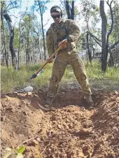  ?? Townsville- based Military Police Private Simon Walkden, digging a blast pit. Pictures: WESLEY MONTS ??