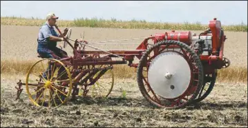  ?? ?? Moline Universal Tractor from the Moline Plow Company. This tractor is pictured plowing, a job that had previously been the job for horses, and the eliminatio­n of this barrier paved the way for tractors to enter the world of farming.