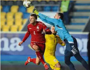  ?? — AP ?? All clear: Lithuania goalkeeper Ernestas Setkus punching the ball during the UEFA Nations League match against Romania at the Ilie Oana Stadium in Ploiesti on Saturday.