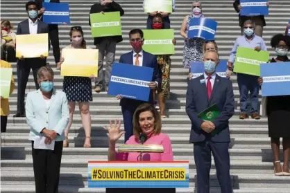  ?? Photograph: Stefani Reynolds/Getty Images ?? The speaker of the House, Nancy Pelosi, joined her colleagues to unveil the climate crisis action plan on Tuesday.