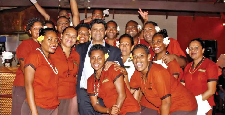  ?? Photo: OFFICE OF THE ATTORNEY GENERAL ?? Attorney-General and Minister for Economy Aiyaz Sayed-Khaiyum (centre) with staff during the Corporate Christmas cocktail at the Outrigger Fiji Beach Resort on Coral Coast on Saturday night.