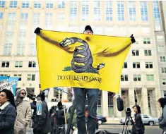  ??  ?? A protest against the end of net neutrality rules outside the FCC building in Washington