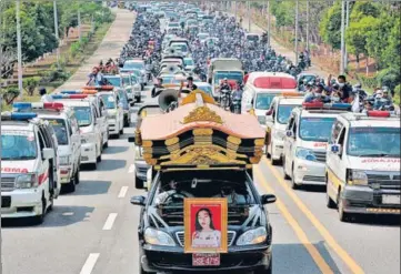  ?? AFP ?? A vehicle carrying the body of protester Mya Thwate Thwate Khine is seen at the front of a convoy during her funeral service on Sunday in Myanmar’s capital Naypyidaw. She died last Friday after being shot earlier this month during a rally against the coup.
