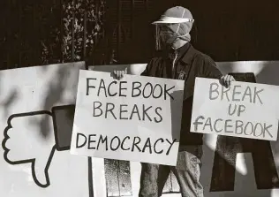  ?? Jeff Chiu / Associated Press ?? Misinforma­tion has proved to be a threat to democracy. Social media companies such as Facebook have a role to play in clamping down on falsehoods and consipirac­ies.