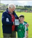  ??  ?? Rathnew’s Bobby Dignam presenting Gavin Cullen with the Man Of The Match award.