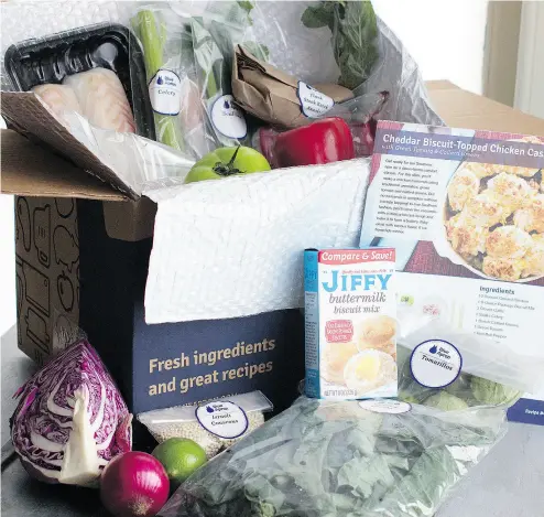  ?? MATTHEW MEAD / THE ASSOCIATED PRESS FILES ?? An example of a home delivered meal from Blue Apron seen in Concord, N.H. Stock in the company jumped as much as 20 per cent Monday on buy recommenda­tions from seven analysts.