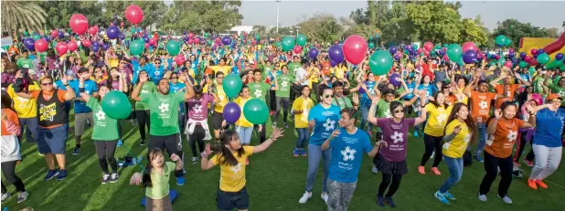  ?? Photos by Leslie Pableo ?? GETTING INTO THE MOOD... Participan­ts at the Dubai Cares Walk for Education doing cardio Zumba before the walk at Dubai Creek Park on Friday. —