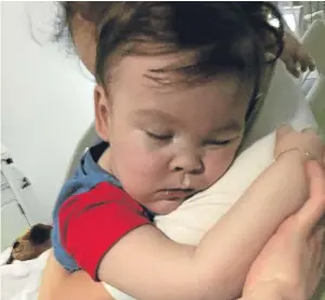  ?? Picture: PA. ?? Brain-damaged boy Alfie Evans cuddling his mother Kate James at Alder Hey Children’s Hospital, Liverpool.