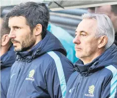  ??  ?? Bert van Marwijk (rught) and Mark van Bommel watch the internatio­nal friendly football match betwwen Norway vs Australia in Oslo. — AFP photo