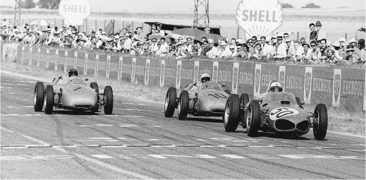  ??  ?? Above: The Reims tradition for slipstream­ing duels is spectacula­rly upheld in July 1961 in the battle between eventual winner Baghetti in a Ferrari and Dan Gurney’s Porsche (12) with occasional interventi­on from Jo Bonnier (10)