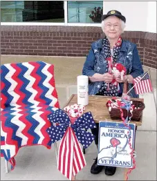  ?? Photo submitted ?? Laurine Barnett, 93, has been passing out red poppies for the American Legion Auxiliary before Memorial Day since 1977. Her favorite location for handing out the crepe paper flowers is at the Siloam Springs Post Office. She will be there passing out...