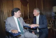  ?? J. SCOTT APPLEWHITE — THE ASSOCIATED PRESS ?? Marc Buoniconti, left, and his father, former Dolphins player Nick Buoniconti, speak after Marc received the American Institute for Public Service Jefferson Award at the Supreme Court in Washington on June 28, 1989.