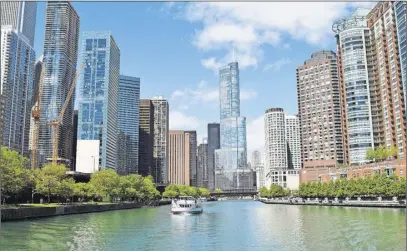  ?? Steve MacNaull photo ?? The Chicago Architectu­re Foundation’s First Lady Cruise plys the Chicago River through the Windy City’s most dense skyscraper concentrat­ion.