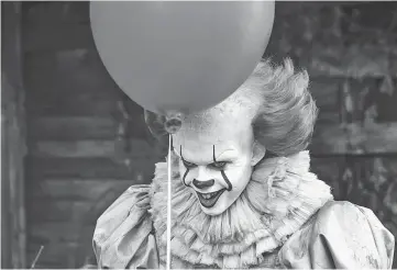  ??  ?? Skarsgard as Pennywise in ‘It’. — Photo courtesy of Warner Bros. Pictures