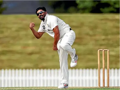  ?? PHOTOSPORT ?? Ajaz Patel didn’t start bowling spin until he was 21. Now he’s in the Black Caps.