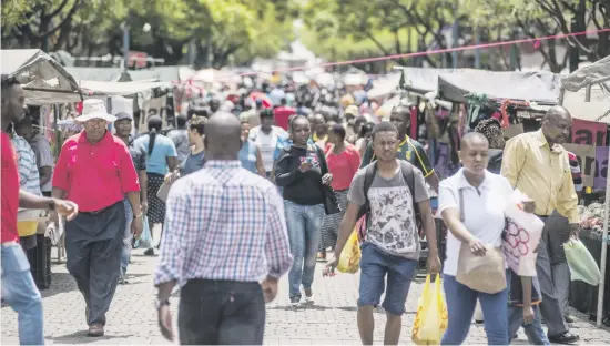  ?? Picture: Bloomberg ?? CHOICE. The expansion of malls into townships creates competitio­n for spazas, which are losing customers to lower prices.