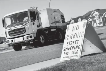  ?? @IMartensHe­rald Herald photo by Ian Martens ?? The city will begin their annual street sweeping program this week and will once again be asking residents to move their parked vehicles to clean the road.