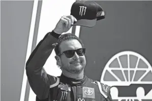  ?? CHARLES KRUPA/AP ?? Kurt Busch tips his cap before a NASCAR Cup Series race at New Hampshire Motor Speedway in Loudon, N.H.